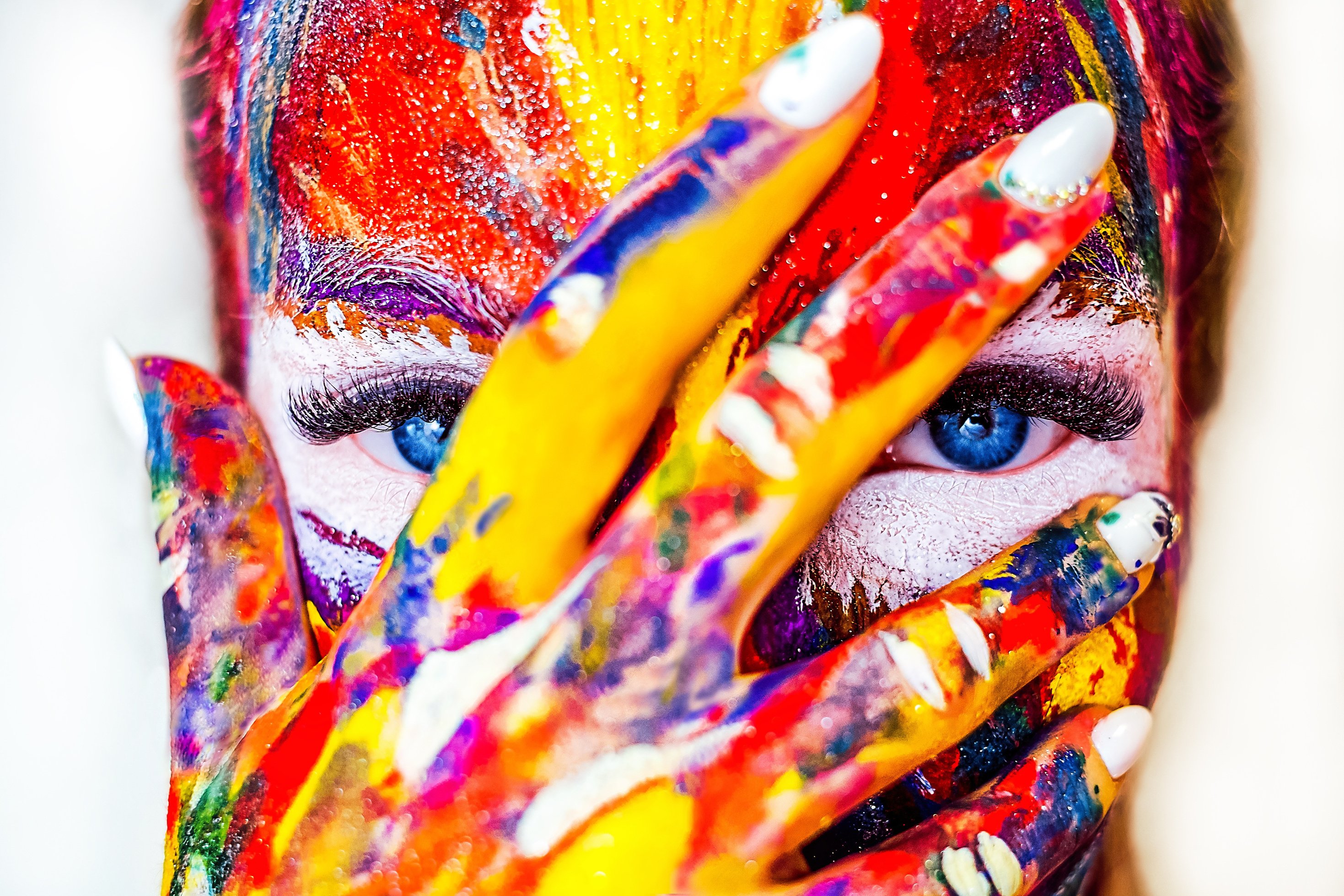 Woman With Face Painted With Colors